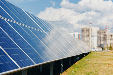 Obraz premium Concept green economy energy. Construction of modern housing complex apartments from solar panels