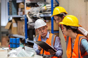 Team Foreman or Team worker working in warehouse. Industrial and industrial workers concept. worker woman order details and checking goods and Supplies.
