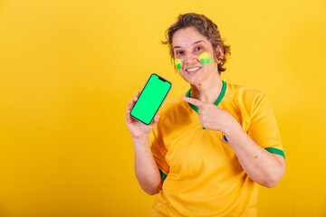 adult adult woman, brazil soccer fan, smartphone, showing screen, online, mobile, apps, app.