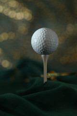 Close-up of golf ball  on green abstract background. New Year card concept