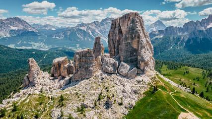 Climbing in Cinque Torri,Dolomites,Italy.Five towers and rock formations close to Cortina d'Ampezzo attract many tourists.Picturesque Dolomite Alps,active summer holiday,steep cliffs.Adventure concept