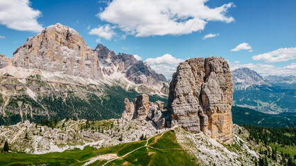 Climbing in Cinque Torri,Dolomites,Italy.Five towers and rock formations close to Cortina d'Ampezzo attract many tourists.Picturesque Dolomite Alps,active summer holiday,steep cliffs.Adventure concept