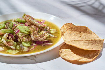 Aguachile, shrimp dish in lemon juice and green sauce, mexican seafood.