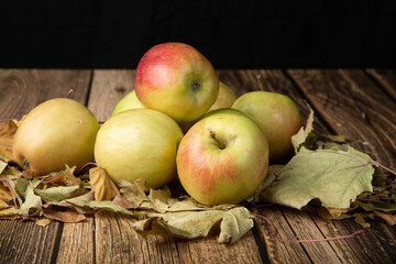 Apples, fresh harvest on a wooden background.Fresh harvest of apples.