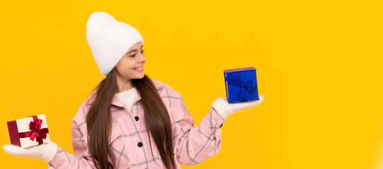 xmas holiday gift. child wearing warm clothes. boxing day. happy new year. Banner of christmas child girl, studio kid winter portrait with copy space.