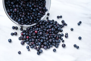 blueberries in a plate spread out on the table close-up. berry antioxidant