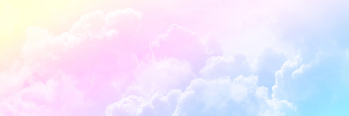 Pastel sky with soft white clouds. Fantastic color fantasy background. Sweet dreams concept for wallpaper, backdrop and design.