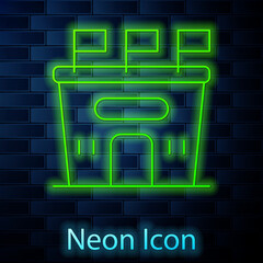 Glowing neon line Football stadium icon isolated on brick wall background. Football arena. Vector