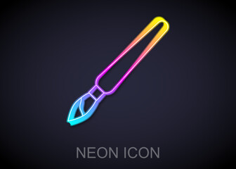 Glowing neon line Paint brush icon isolated on black background. Vector