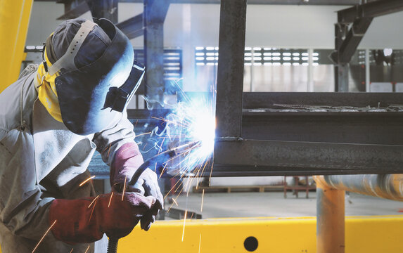Welders are welding structural steel using Flux Core  welding machines, welding is the world's largest construction industry, the smoke and light from welding are dangerous to technicians' health.