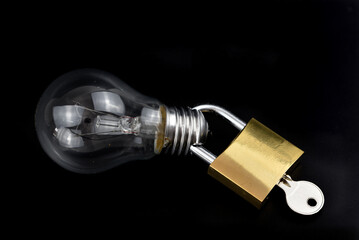electric lightbulb with metal padlock