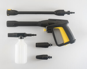 a water gun with a foaming agent and various nozzles for a high-pressure car wash. isolated on...