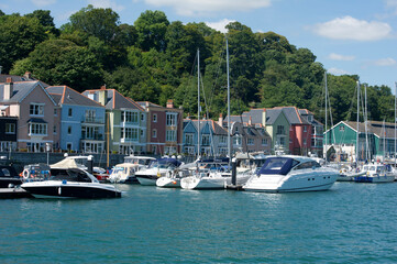 Fototapeta na wymiar Boats and buildings on the waterfront at Dartmouth, Devon
