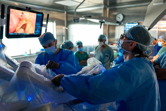 Surgeons Perform Surgery Using A Robot