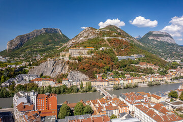 The drone aerial view of hill and fortress of the Bastille. The Bastille located at the south end of the Chartreuse mountain range and overlooking the city of Grenoble, France. 