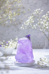 Obraz na płótnie Canvas Lavender Gin and Tonic Punch Cocktail. Elegant glass filled with violet cocktail or mocktails