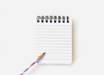 Education concept - close up pencil and notepad sheet in the background. Mock-up Copy space