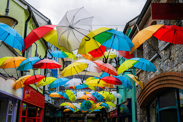 Colourfull umbrella's in the centre. 
 The view on the shopping centre of Kilkenny.   - obrazy, fototapety, plakaty