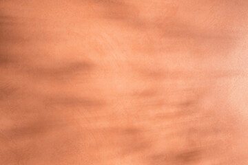 abstract light terracotta background. Copy space and shadows.