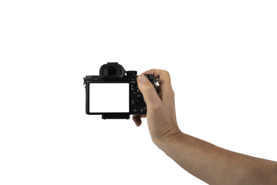 a mirrorless camera in a male hand on a transparent background