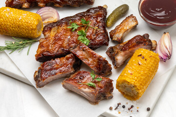 Grilled pork ribs with barbecue sauce  and grilled vegetables. top view 