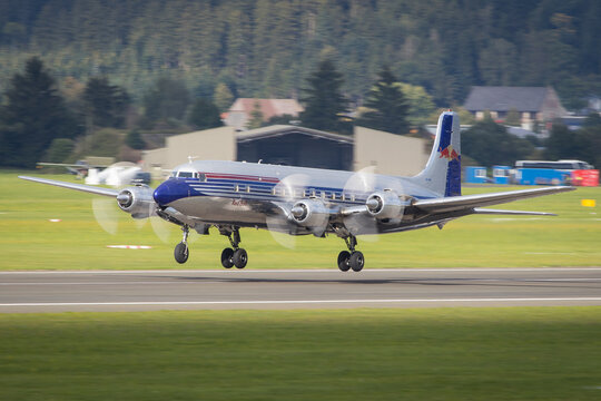 The beautiful restored Douglas DC-6 of the Flying Bulls fleet taking off in Zeltweg in Austria