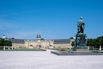 Monument of Karl Friedrich on the background of the Karlsruhe Palace in Karlsruhe, Baden-Wuerttemberg Germany, side view