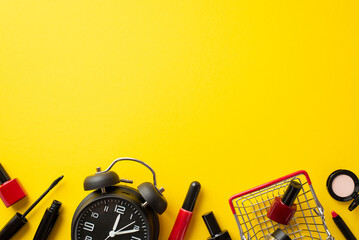 Black friday concept. Top view photo of alarm clock shopping cat with cosmetics mascara eyeshadow nail polish and lip gloss on isolated yellow background with copyspace