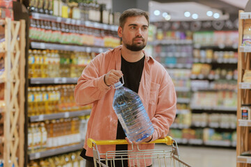 the guy makes purchases in the supermarket, the concept of shopping