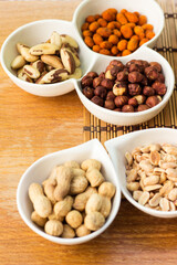 Assortment of nuts on rustic wood table