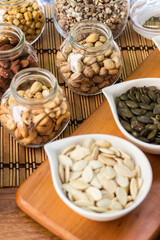 Assortment of nuts on rustic wood table