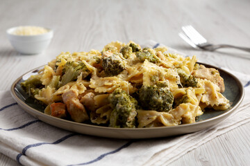 Homemade One-Pot Creamy Chicken and Broccoli Pasta on a Plate, low angle view. Close-up.