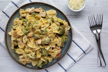 Homemade One-Pot Creamy Chicken and Broccoli Pasta on a Plate, top view. Flat lay, overhead, from above.