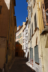 Old Narrow street and apartment buildings in Toulon, Riviera, Cote d'Azur.