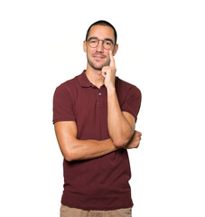 Happy young man making a gesture of doubt