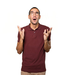 Happy young man looking up gesture