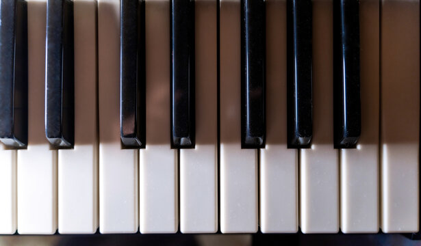 Old Dusty Black And White Piano Keys Wallpaper Or Background, View From Above