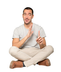 Haughty young man making a contemptuous gesture