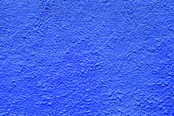 blue wall rough abrasive surface texture closeup photo