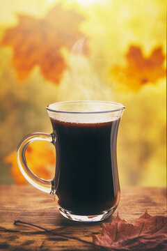 cup of coffee on the background of autumn maple leaves, autumn mood, autumn toned images