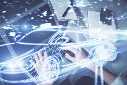 Double exposure of woman hands typing on computer and automobile theme drawing. High Tech concept.