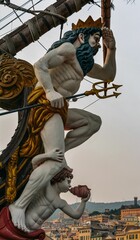 Neptune statue on a galleon in the port of Genoa, Italy