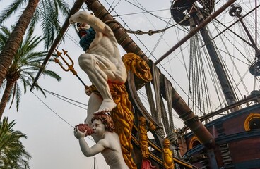 Neptune statue on a galleon in the port of Genoa, Italy © Martina_priel/Wirestock Creators