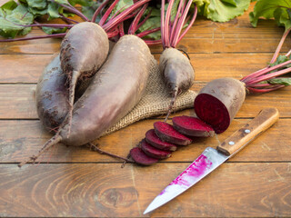 Organic vegetable beetroot on a wooden background close-up. Vegetarian food