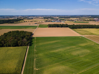 Obraz premium Aerial View of landscape with agricultural fields. Drone shot. harvested fields