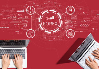 Obraz na płótnie Canvas Forex trading concept with people working together with laptop computers