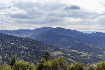 Obraz premium Beautiful panoramic views of the Carpathian Mountains from Uzhotsky pass high peak mountain in Ukrainian Carpathians Mountains. Summer