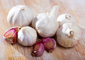 Garlic on wooden table closeup. High quality photo