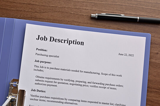 There is dummy documents that created for the photo shoot on the desk about Job Description.