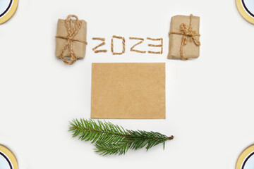 Blank eco card. Happy New year 2023. New Year Concept welcoming New Year 2023 written by craft rope...
